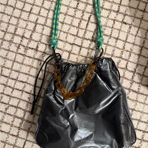 Rotunda Gray Metallic Nylon Drawstring Shoulder Bag with Amber Chain Accent